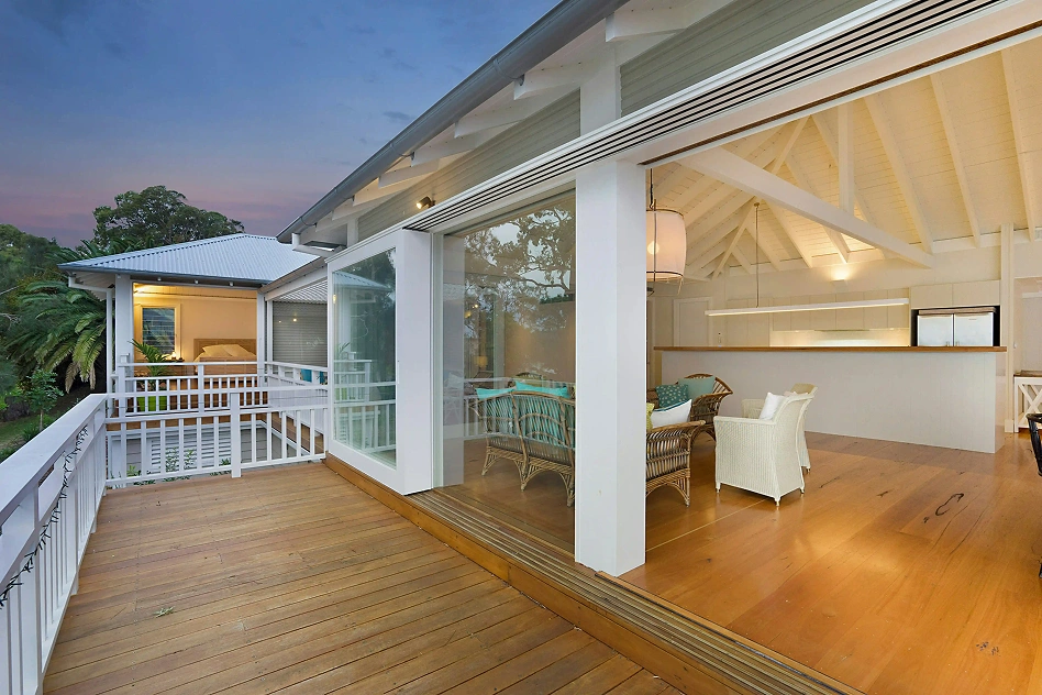 Elevated composite deck with white railings and outdoor seating — Iconic Upscale Texas