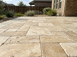 Travertine paver patio with large-format cream stone tiles — Iconic Upscale Houston Texas